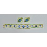 A sapphire, green garnet and diamond set wide yellow precious metal bracelet,