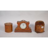 A 19th century mahogany and inlaid pin cushion of circular form with a frieze drawer and three bun