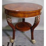 A Victorian style mahogany circular two tier centre table on silver painted claw feet,