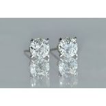 A pair of solitaire diamond earstuds,