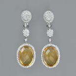 A pair of white gold, citrine and diamond set pendant earrings, the oval diamond cluster earclips,