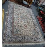 A Chinese silk carpet, the ivory field with a bold central medallion, matching spandrels,