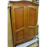 A 20th century walnut Continental style two door wardrobe on cabriole supports,