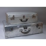 Two aluminium suitcases, the largest 74cm x 44cm x 24cm.