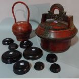 A 19th century Chinese red lacquered wedding basket with painted flower decoration, 31cm high,