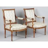 A pair of Louis XVI style gilt metal mounted square back open armchairs with bow seat on tapering