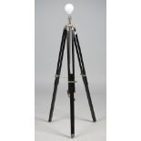 A modern ebonised wood and white metal adjustable floor lamp,