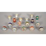 Seventeen miniature Halcyon Days enamel eggs and trinket boxes, 3.3cm, (17).