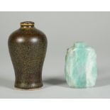 A Chinese jadeite snuff bottle, 20th century, each end carved with a chilong, 4.5cm.