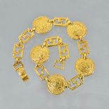 A gold necklace, cast as a row of five circular discs depicting classical portraits,