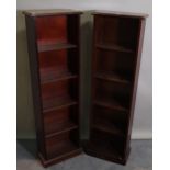 A pair of 20th century mahogany open bookcases on plinth base, 38cm wide x 129cm high.