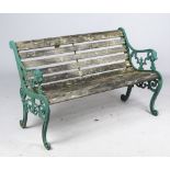 A 20th century green painted cast iron garden bench,