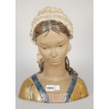 A Lladro matte glaze bust of a young girl, blue printed mark to base, 34cm high.