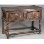 A Charles II and later dresser base with pair of geometric moulded drawers on turned supports