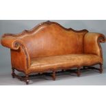 An 18th century Italian style tan leatherette upholstered sofa,