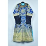 A Chinese blue-ground `eight dragon' robe, circa 1900,