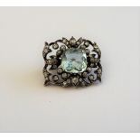 A gold backed and silver fronted aquamarine and diamond brooch,