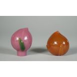 Two Peking glass snuff botlles, each in the form of a peach, one of purple glass with green leaves,