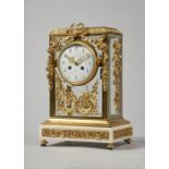 A French ormolu and white marble four glass mantel clock In the Louis XVI style,