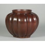 A Japanese bronze vase, Meiji period, of lobed bulbous form,