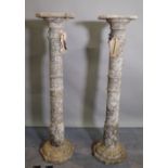 A pair of late Victorian variegated grey marble pedestals, chamfered tops on ring turned columns,