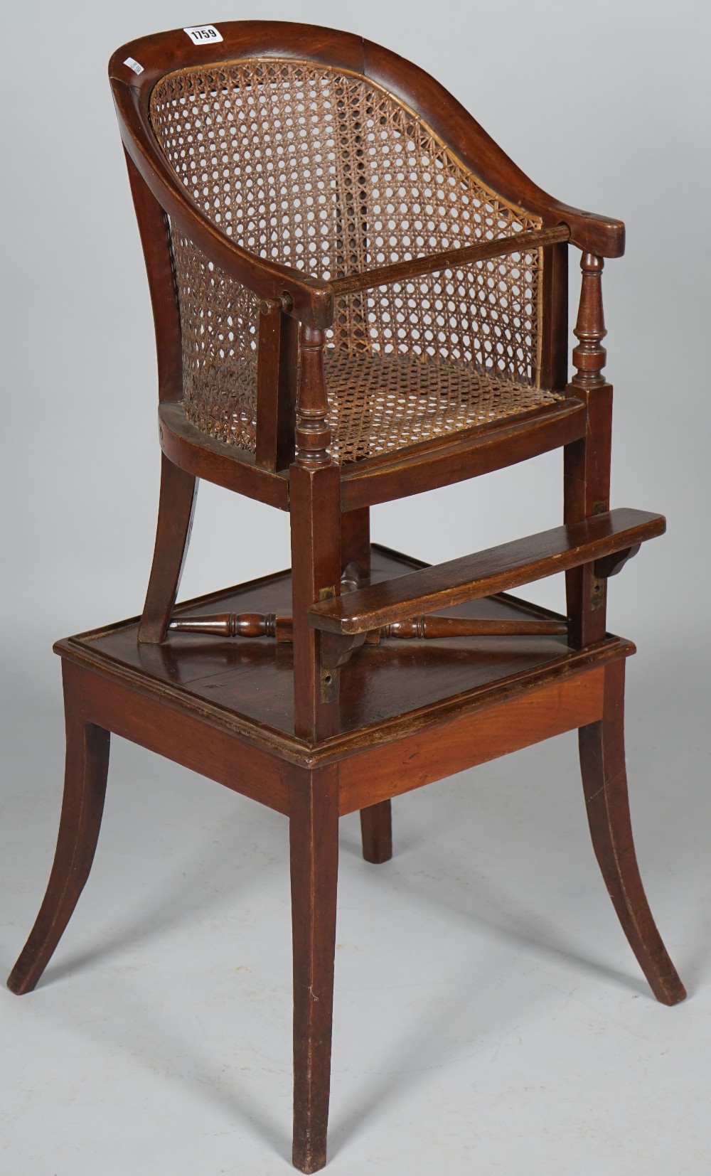 A Regency mahogany and cane tub back child's chair and stand, 47cm wide x 89cm high.