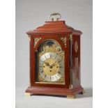 An Edwardian giltmetal-mounted mahogany three train quarter chiming bracket clock The ogee case