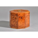 A George III burr yew wood tea caddy of compressed octagonal form, with twin compartment interior,