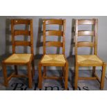 A set of six 20th century oak ladder back dining chairs, 45cm wide x 105cm high, (6).
