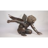 A modern bronze 'Cupid' modelled kneeling, with arm outstretched, 39.5cm high, (a.f.).