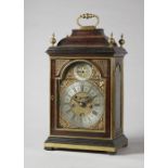 A George I brass-mounted fruitwood striking table clock with pull-quarter repeat By Simon de