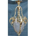 A French ormolu and frosted glass hall lantern, ovoid shaped in the Louis XVI style, 90cm high.