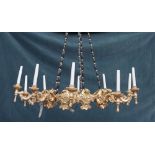 An Italian giltwood ten light corona chandelier,