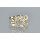 An 18ct gold and diamond three stone ring,