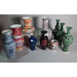 A quantity of mostly 20th century Asian ceramic vases of various styles and forms,