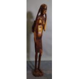 An early 20th century tribal carved African wooden figure.
