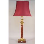 A rouge griotte marble and ormolu mounted table lamp, of Corinthian column form with shade,