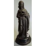 A 20th century bronze figure of a woman reading a book on circular plinth base, 41cm high.