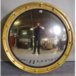 A Regency style giltwood convex mirror, 90cm wide.