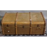 An early 20th century canvas and wood band travelling trunk, 126cm wide.
