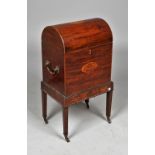 A George III inlaid mahogany dome top cellarette on tapering square supports, 38cm wide x 70cm high.