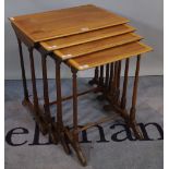 A Regency style mahogany nest of four tables with ring turned supports,