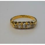 An 18ct gold and diamond set five stone ring,
