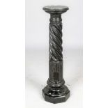 A verde marble pedestal with spiral carved fluted body, 108cm high.
