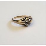 A diamond set single stone ring, mounted with a cushion shaped diamond, ring size H.