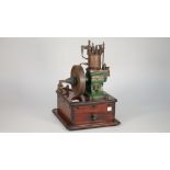 A rare demonstration vertical single cylinder, water cooled, hot tube ignition 'Metrogas' engine,