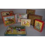 Toys comprising; a quantity of mid-20th century vintage puzzles and building blocks, (qty).