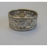 A diamond set wide band full eternity ring, in a pierced openwork design,