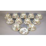 A part set of Herend porcelain chocolate cups, covers and stands,