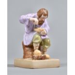 A Russian biscuit porcelain figure of a Lapti Player, Gardner factory, late 19th century,